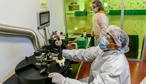 Student working in semiconductor clean room
