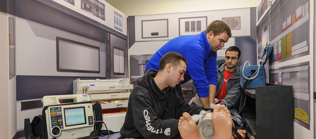 Students working on a medical patient